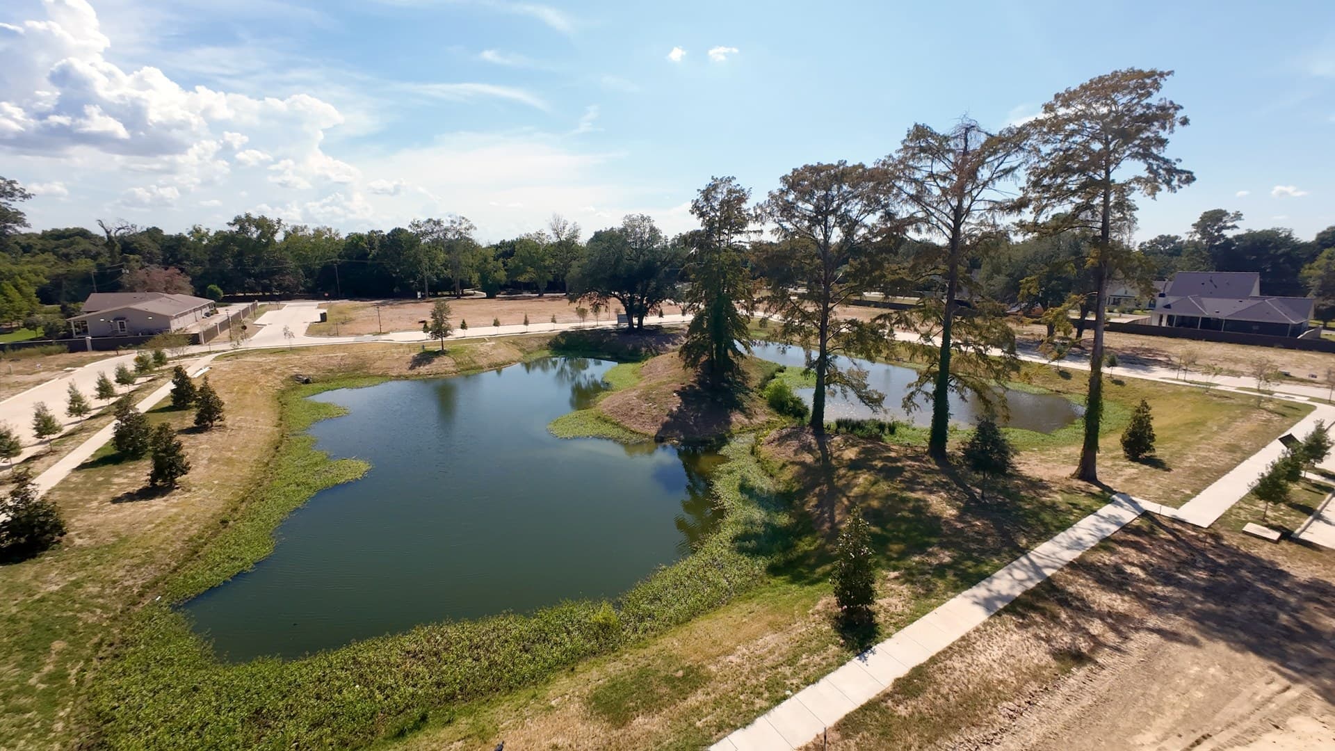 The twin-pond cypress amenity at the heart of Benton at Magnolia Woods
